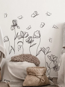 Minimalist black line art wall stickers with tulip flowers and butterflies in a home setting