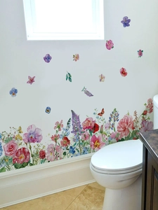 Macro detail of watercolor wildflower and butterfly PVC wall stickers for baseboard decor
