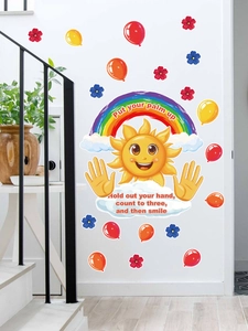 Detail of colorful sun and rainbow wall stickers with balloons for nursery room decor