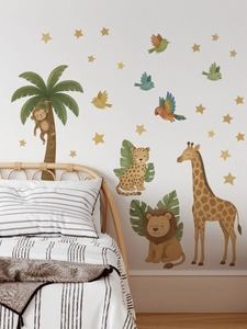 Detail of jungle animal wall decals with lions and giraffes in a cozy kid bedroom setting