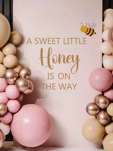 Pink honey bee baby shower backdrop with sweet little honey phrase and balloon arch
