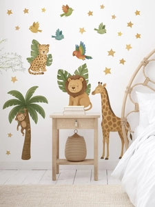 Close-up of watercolor jungle animal wall stickers featuring lions and giraffes in nursery