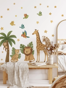 Detail of jungle animal wall decals with giraffe and lion in soft Morandi colors