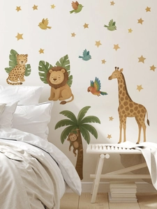 Detail of watercolor jungle animal wall decals with lions and giraffes in a nursery setting