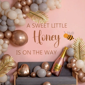 Honey bee baby shower balloon arch kit with rose gold champagne foil and palm leaves