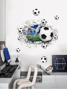 Macro detail of a 3D soccer player wall sticker breaking through a white brick wall surface