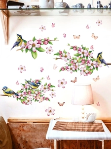 Pink cherry blossom wall decals with realistic birds and butterflies on white wall