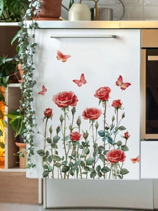 Close-up of realistic red rose and butterfly PVC wall stickers on white furniture