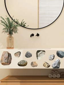 Detail of self-adhesive PVC wall stickers with natural stone texture on a bathroom wall