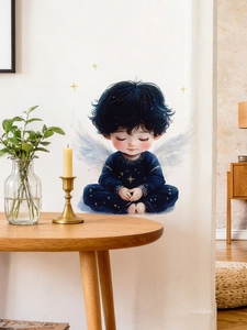 Detail of angel boy wall sticker applied on white wall in a cozy bedroom setting