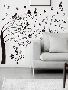 Détail du sticker mural arbre avec notes de musique en PVC noir pour salon moderne
