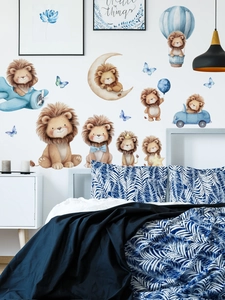 Detail of cartoon lion wall stickers featuring airplanes and balloons in a kid's bedroom