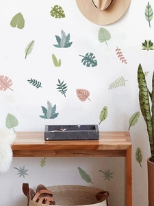 Tropical green leaves wall decals displayed in a minimalist Nordic style home interior decor