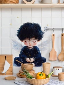 Detail showing an angel boy wall sticker on white kitchen tiles with home decor