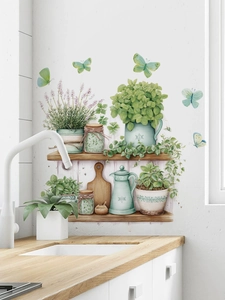 Detail of PVC wall stickers featuring watercolor green potted plants and butterflies