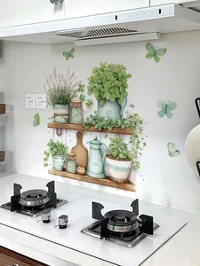 Detail of green potted plant wall stickers with herbs and butterflies in a kitchen setting