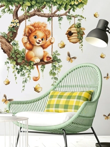 Detail of cartoon lion on a tree swing wall sticker in a cozy nursery room setting