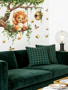 Detail of cartoon lion swing wall decal showing the vibrant colors and branch texture