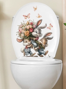 Detailed view of self-adhesive bunny and rose PVC stickers applied on a toilet lid