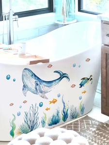 Detailed view of watercolor sea life wall stickers applied to a modern bathtub side