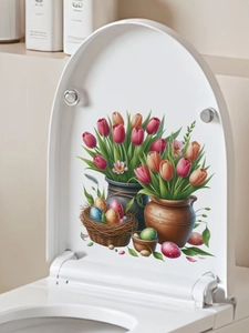 Detailaufnahme von Oster-Tulpen und Eier-PVC-Aufklebern auf einem weißen Toilettendeckel