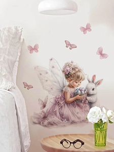 Detail of fairy girl with rabbit wall sticker above bed in a cozy bedroom scene