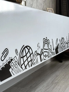 Detail showing minimalist black line school supplies wall decals on white surface