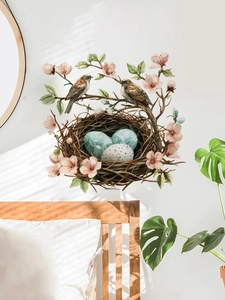 Realistic Easter wall sticker featuring birds, nest and peach blossoms in a bedroom