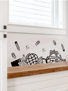 Detail of black PVC wall decals with school elements along a white wall edge