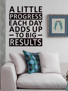 Detail of inspirational black vinyl wall decal on grey living room background