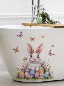 Detailed view of colorful Easter bunny and egg decals on a white bathtub wall