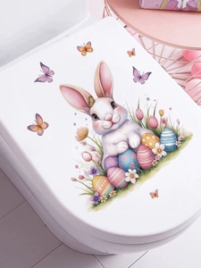 Close-up of Easter bunny and colorful eggs wall stickers on white surface for decor