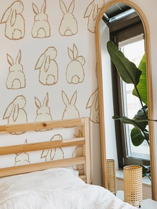 Detail of Easter bunny wall stickers showing hand-drawn rabbit design in a cozy bedroom