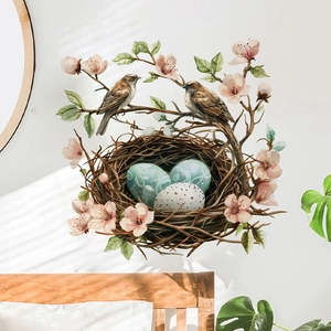 Easter wall decal featuring a bird nest, floral branches and eggs on white wall