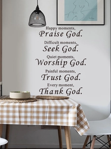 Detailed view of black vinyl wall sticker with inspirational faith quotes in a home dining area