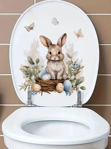 Detailed view of Easter bunny and egg sticker applied to a white toilet seat cover