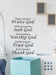 Detail of black inspirational English quote wall stickers on white living room background