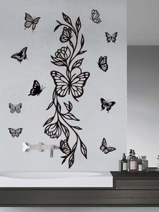 Detail of black hollow butterfly wall stickers and floral vines in modern bathroom decor