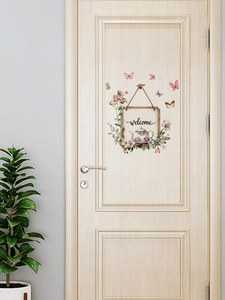 Detail of self-adhesive butterfly door stickers with floral teapot and welcome sign