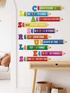 Detail of colorful pencil wall stickers featuring class rules on a white bedroom wall