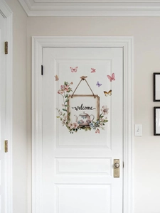 Detailed view of PVC floral door sticker with butterflies and a welcome teapot sign