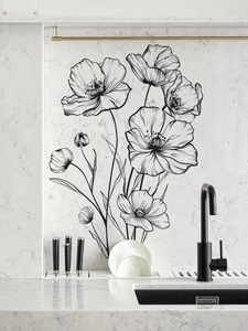 Detail of black floral line art wall stickers on white marble background in kitchen
