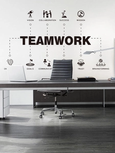 Close-up of teamwork theme wall sticker with vision and mission quotes in modern office