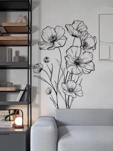 Detail of minimalist black line art poppy wall stickers on a modern living room wall