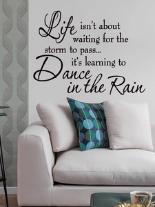 Detail view of Life is learning to dance in the rain wall decal stickers in a modern living room