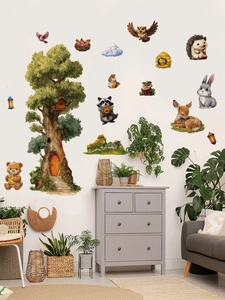 Detail of forest animal wall stickers with cartoon bear and deer in a cozy nursery room