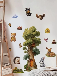 Detail of forest animal wall stickers with treehouse and cute raccoon on white wall