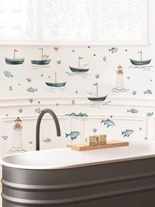 Detail of nautical wall stickers with sailboats and lighthouses on bathroom walls