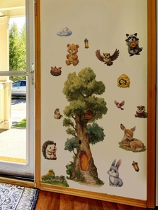 Detailed forest wall decal featuring a tall tree house with animals for nursery decoration