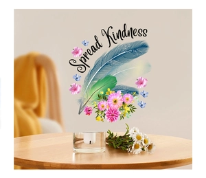 Detail of Spread Kindness wall sticker featuring watercolor feathers and pink flowers